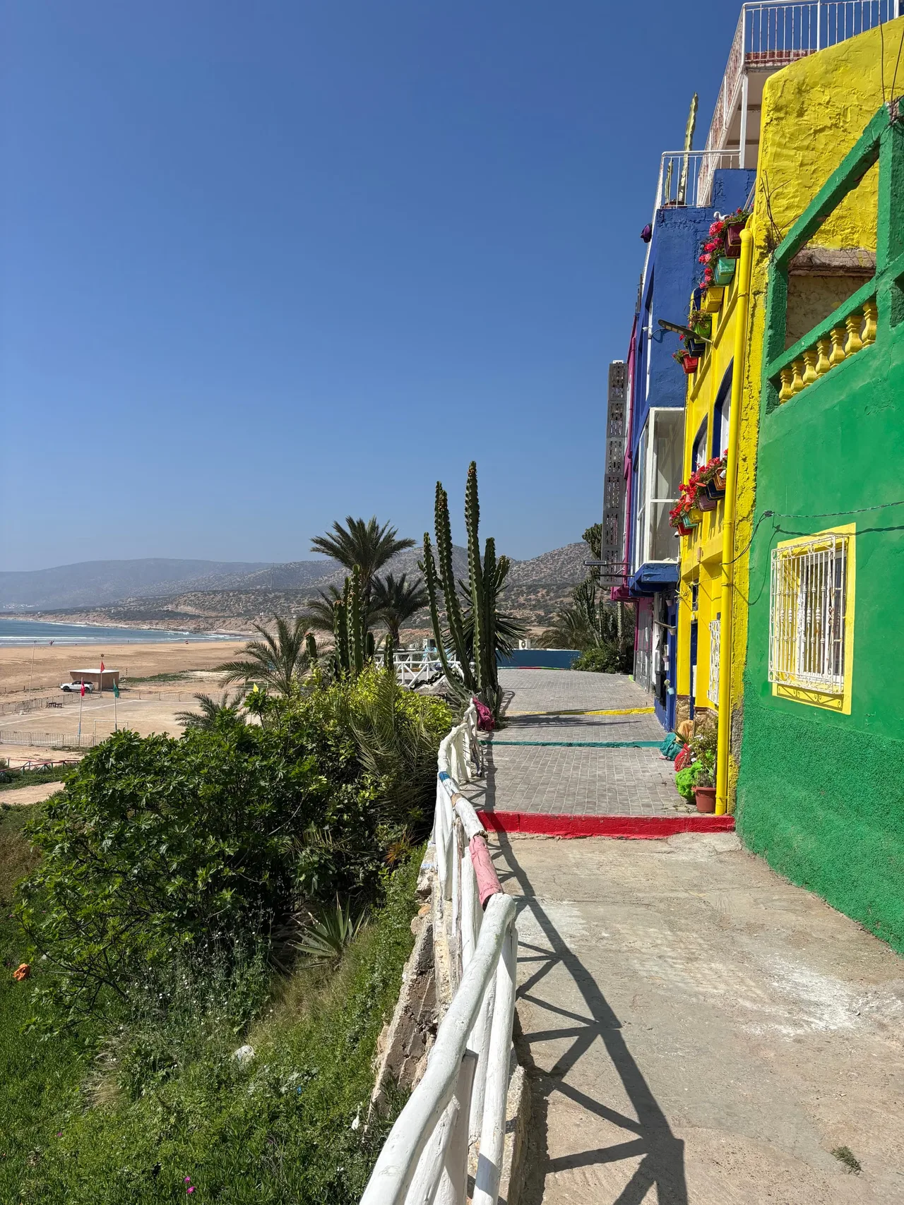 Vibrant beachfront buildings in Agadir under a clear blue sky