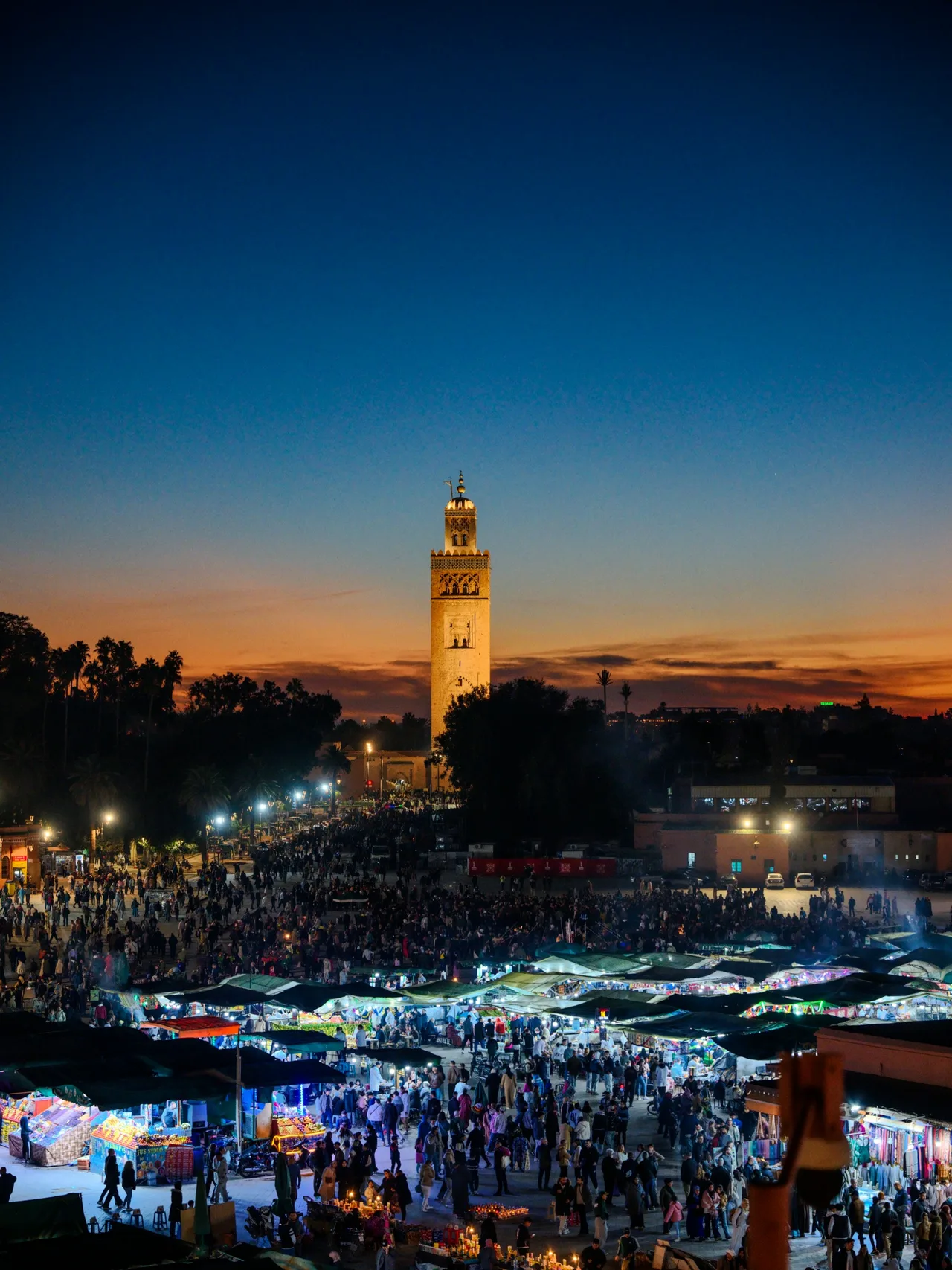 Jemaa el-Fna square in Marrakech with the Koutoubia minaret at dusk