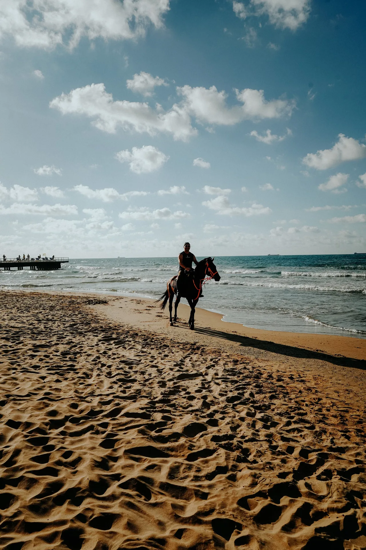 Man riding a horse along the beach near Agadir