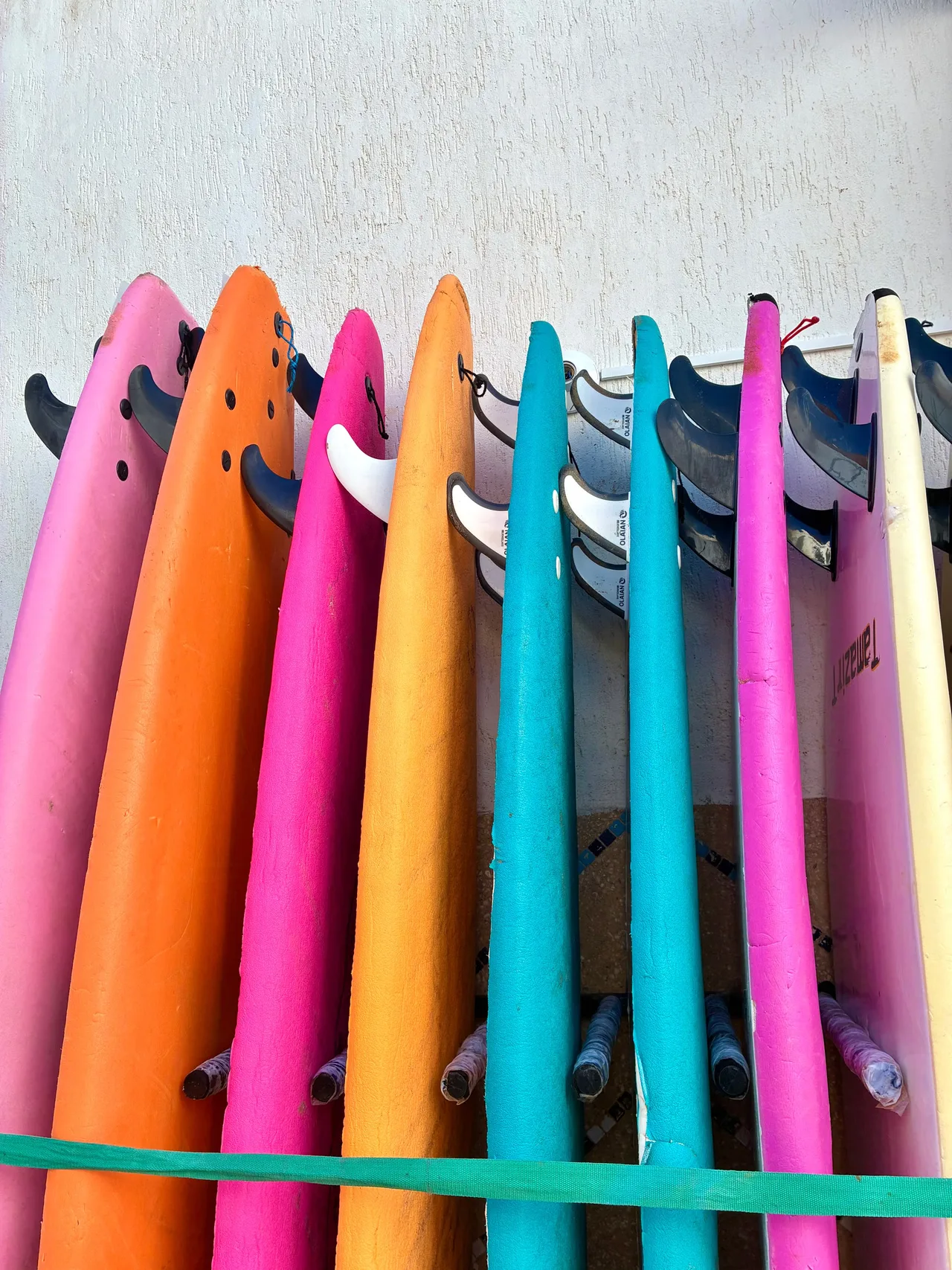 Colourful surfboards lined up in Taghazout, Morocco